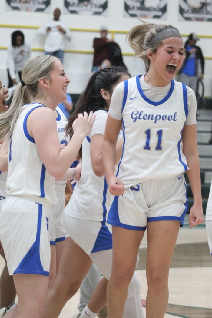 Glenpool players celebrate their Class 5A regional tournament win.